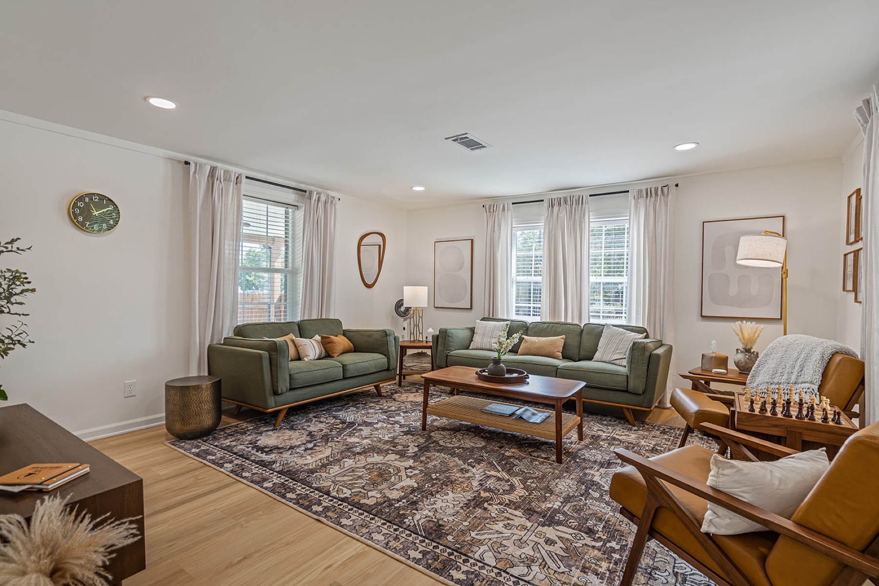 Bright living room with comfortable seating and warm cottage details